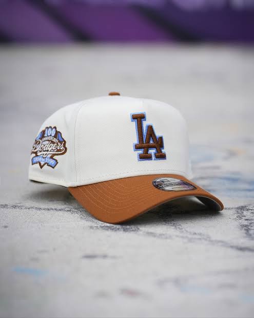 New Era 9FORTY A-Frame snapback hat featuring the Los Angeles Dodgers logo. It is designed with a two-tone style, combining a cream or white crown with a brown