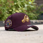 New Era Atlanta Braves 9FORTY A-Frame Snapback Hat, featuring a distinctive maroon or walnut color scheme