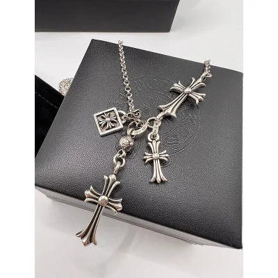 Chrome Hearts sterling silver rosary-style necklace featuring multiple cross pendants.