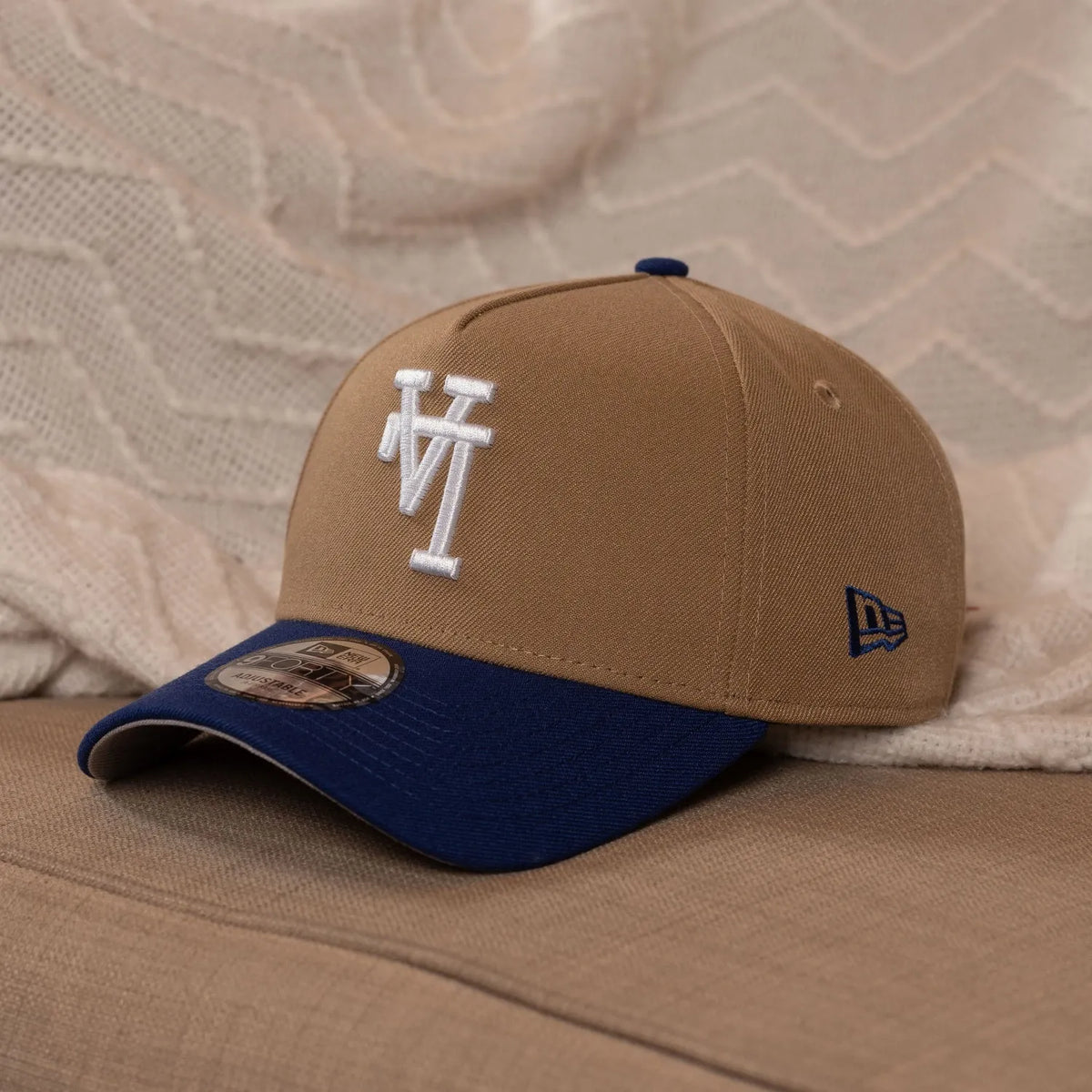 New Era MLB Los Angeles Dodgers "Upside Down" Logo 9FORTY A-Frame Snapback Hat in the Khaki / Royal Blue colorway.