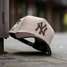 New Era 9FORTY A-Frame snapback baseball cap featuring the New York Yankees logo brown and beige in color
